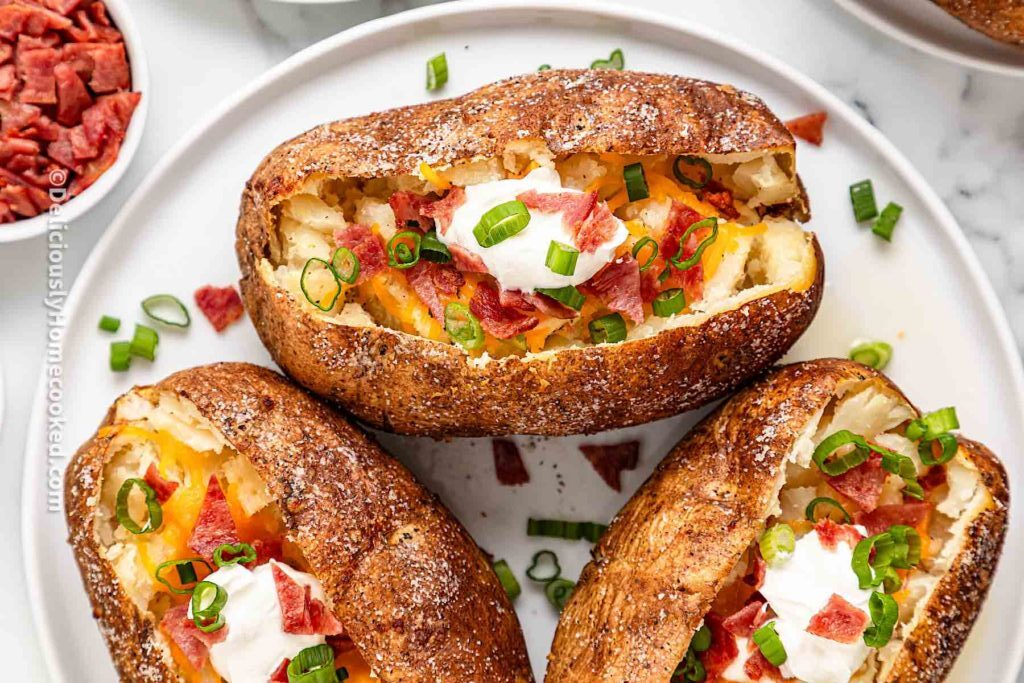 Loaded baked potatoes with bacon and cheese