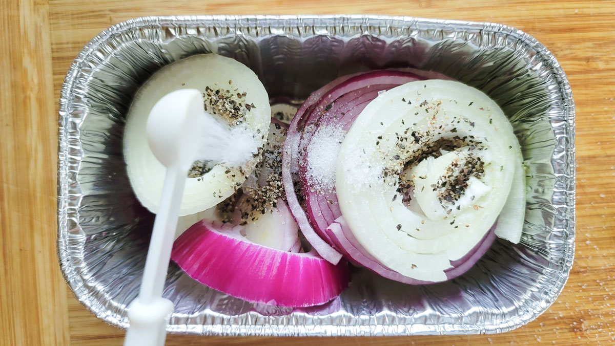 Red and Uellow onions in a aluminum bread pan.