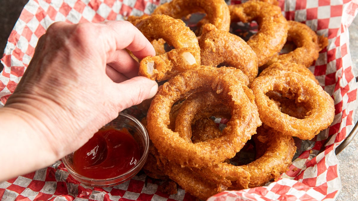 Bite shot of the inside of a perfectly cooked onion ring. 