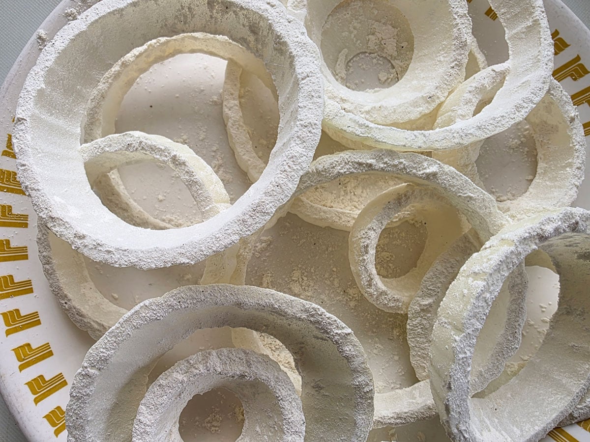 Dredged onion stacked on a plate.