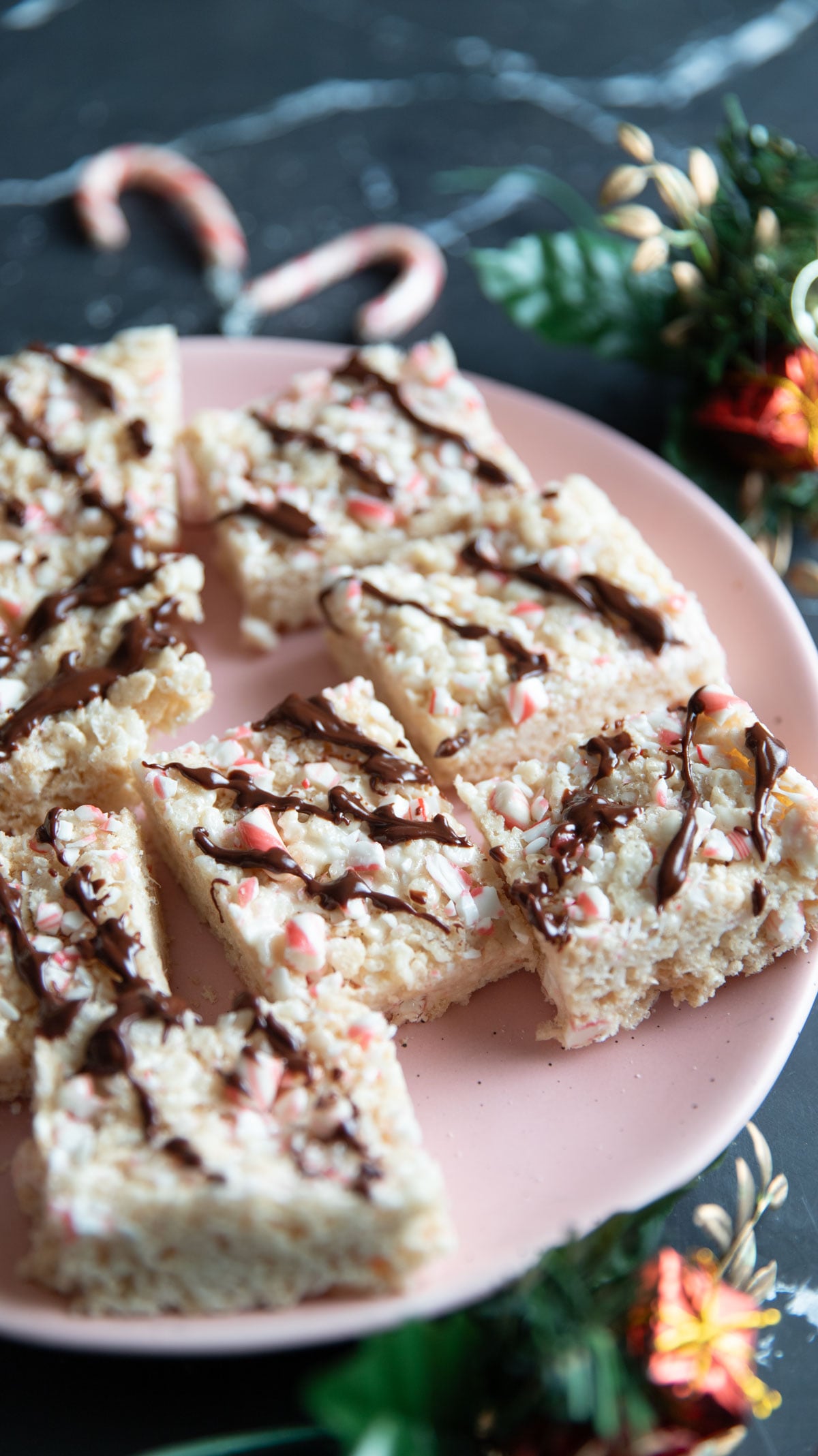 Peppermint Rice Krispies Treats on a pink plate.