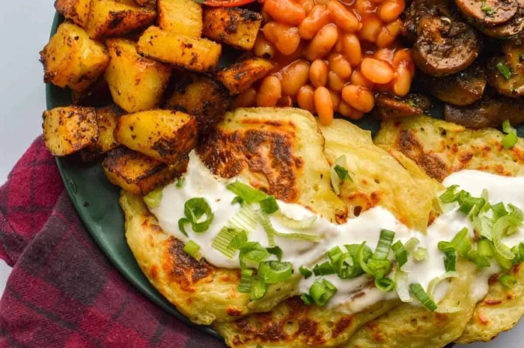 An overhead shot of Easy Vegan Boxty (Irish Potato Pancakes) in a breakfast bowl with other sides.