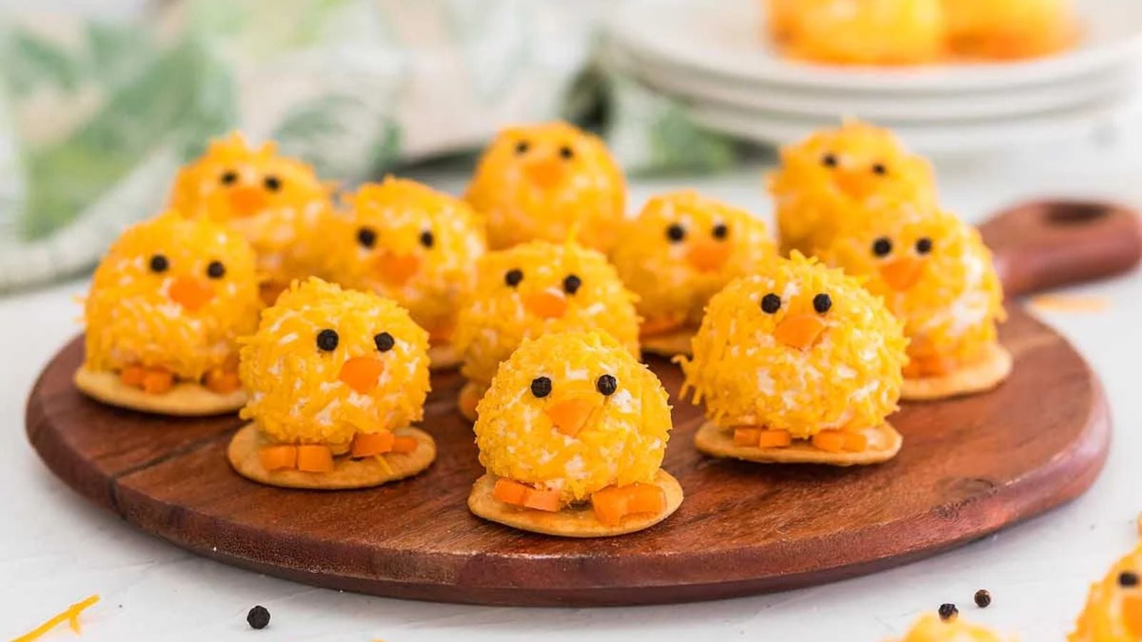 Baby Chick Mini Cheese Balls on a wooden board.