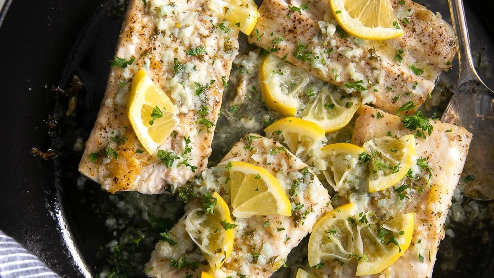 Mahi Mahi With Lemon Garlic Sauce on a pan.