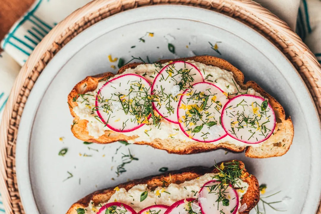 Tofu Ricotta Toast with Radishes & Fennel Frond Herb Sprinkle
