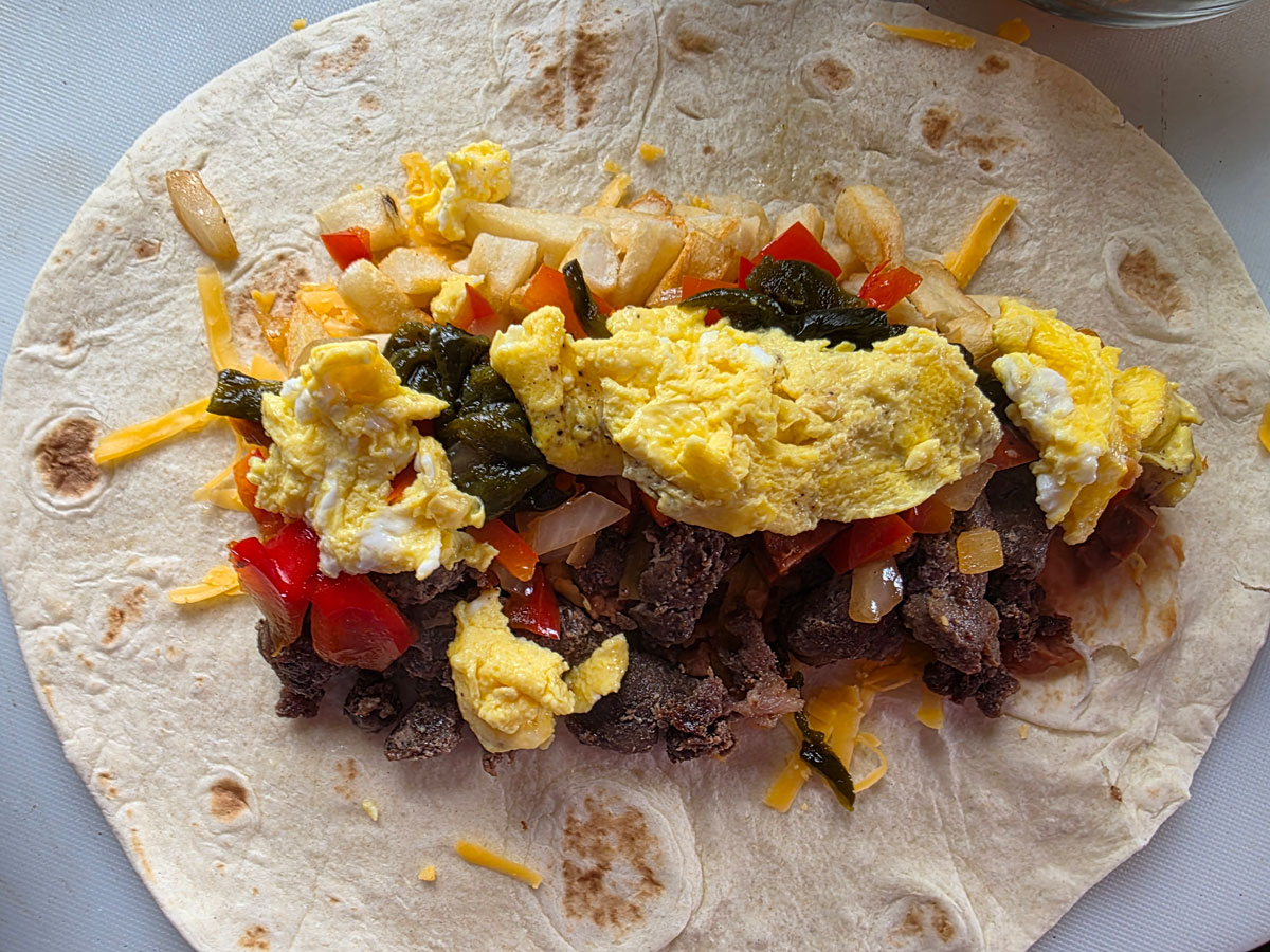 Peppers and eggs added to the burrito.