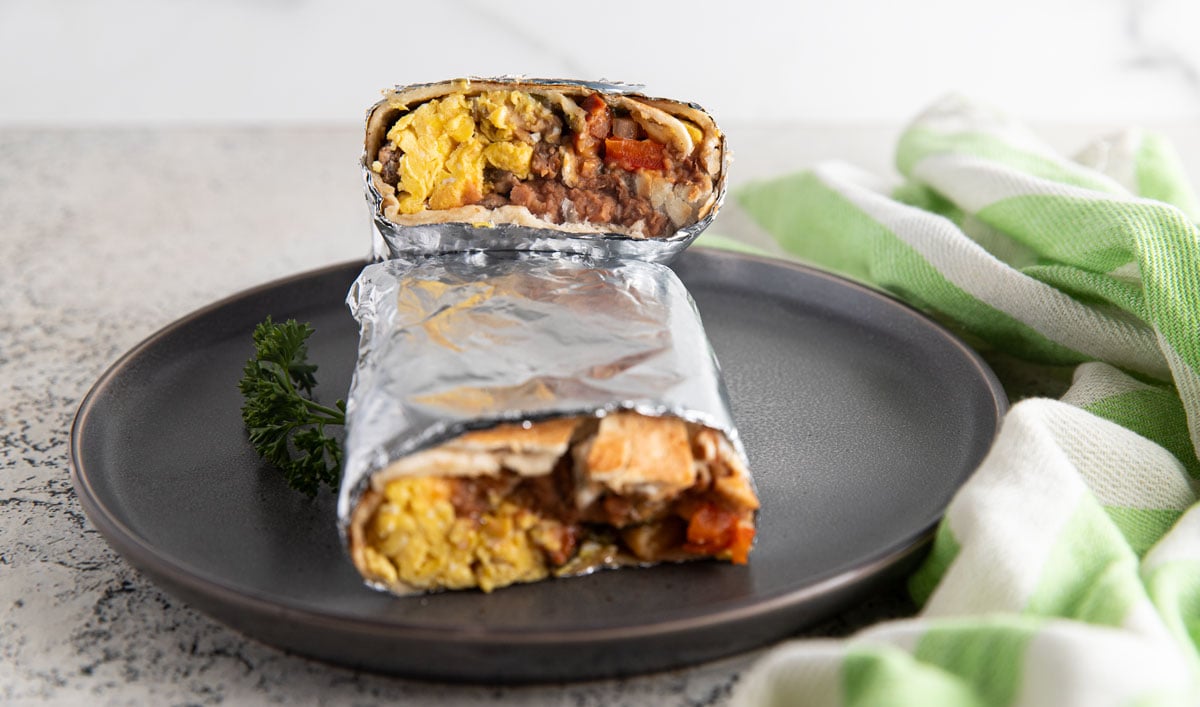 Two halves of burritos stacked on top of each other.