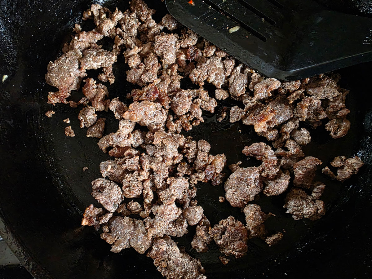 Brown chorizo in the cast iron skillet.