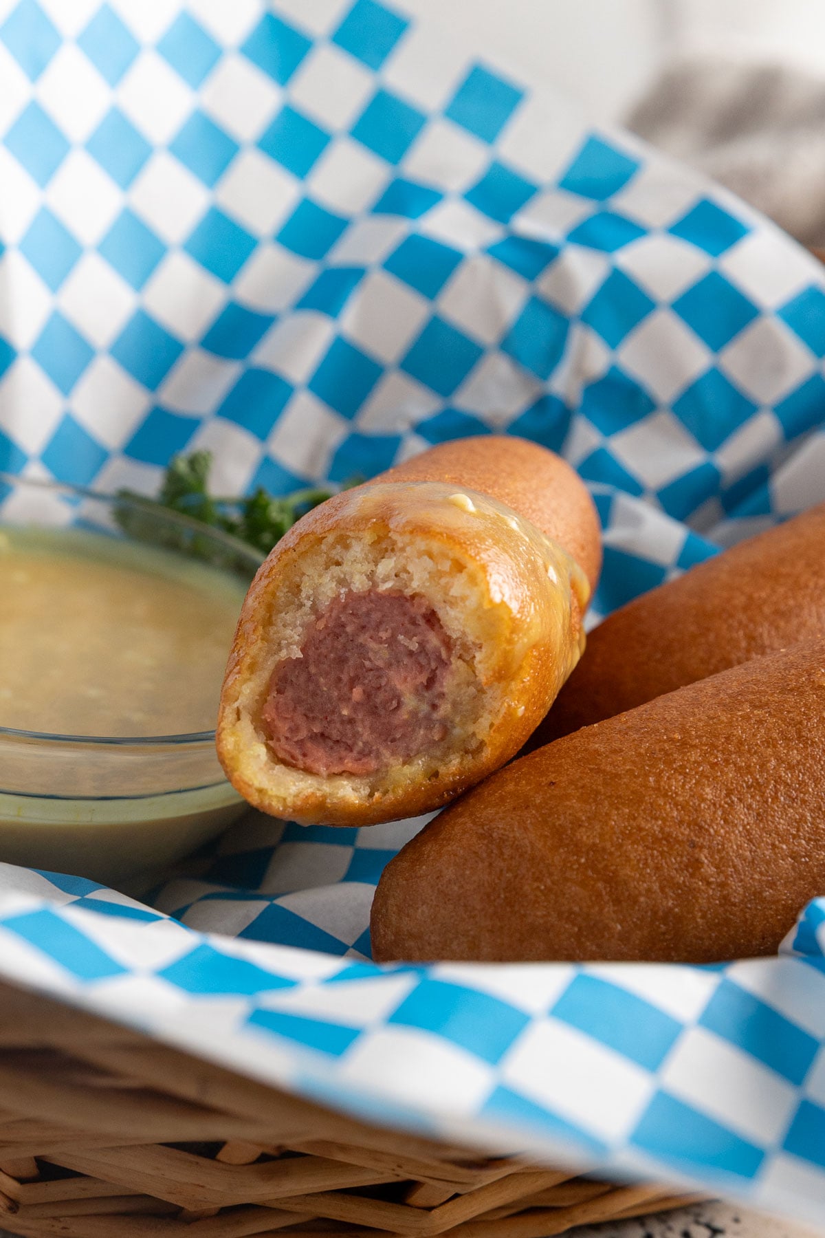 Bite taken out of a corn dog.