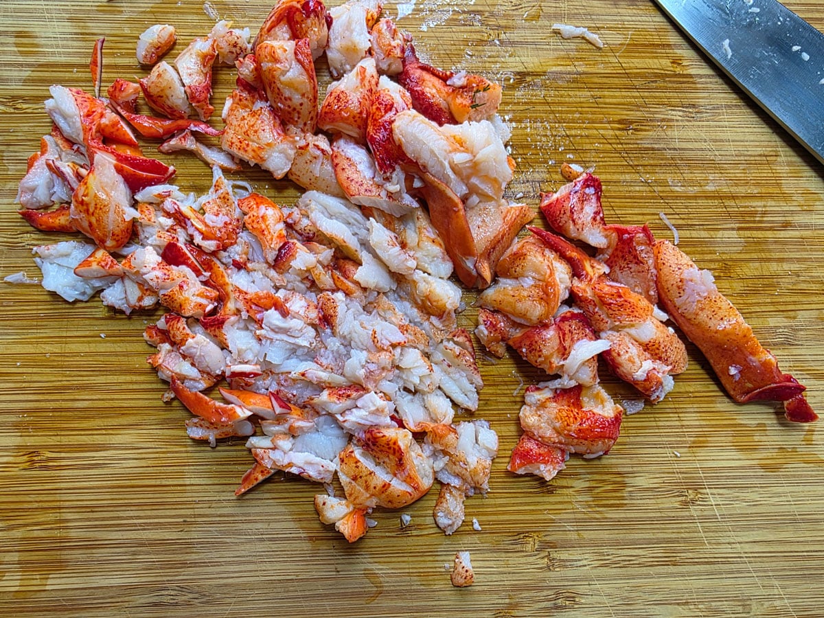 Chopped crab on a cutting board.