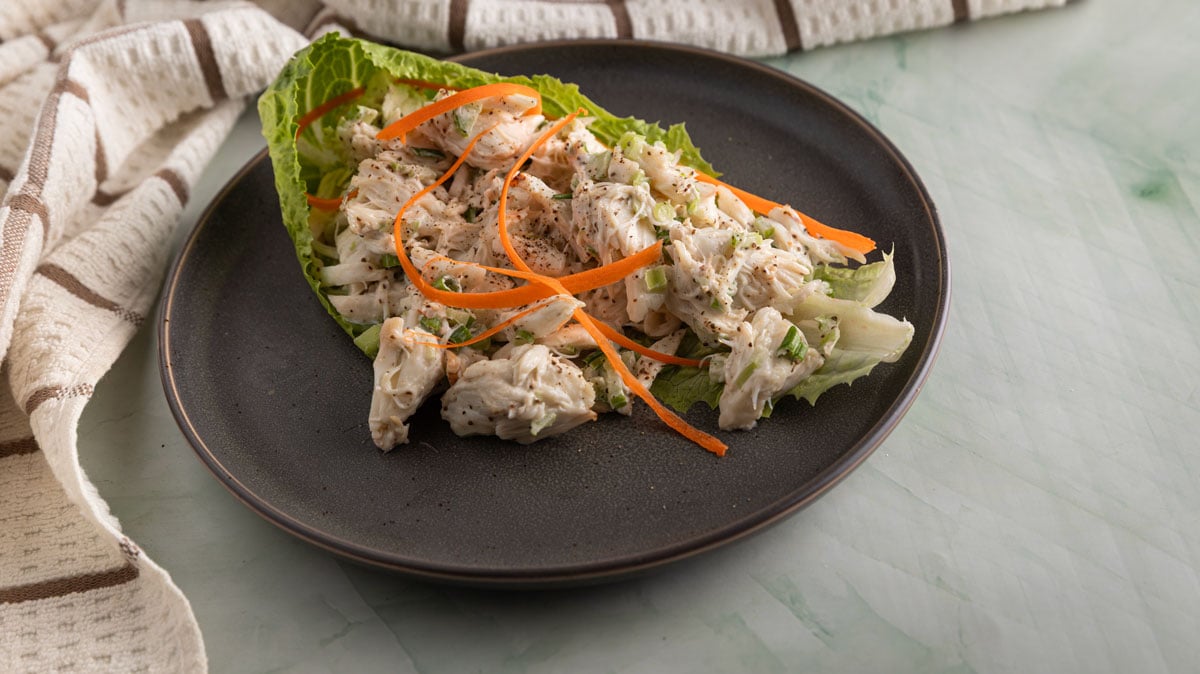 Crab salad with carrot ribbons.