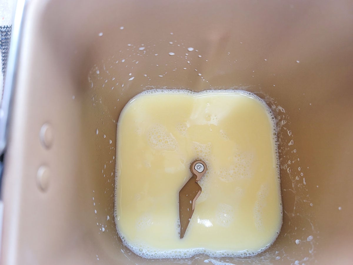 Warm water or milk poured into a bread machinie.