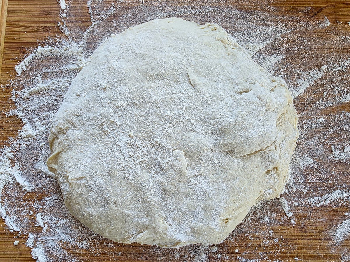 Ball of dough on a floured board.