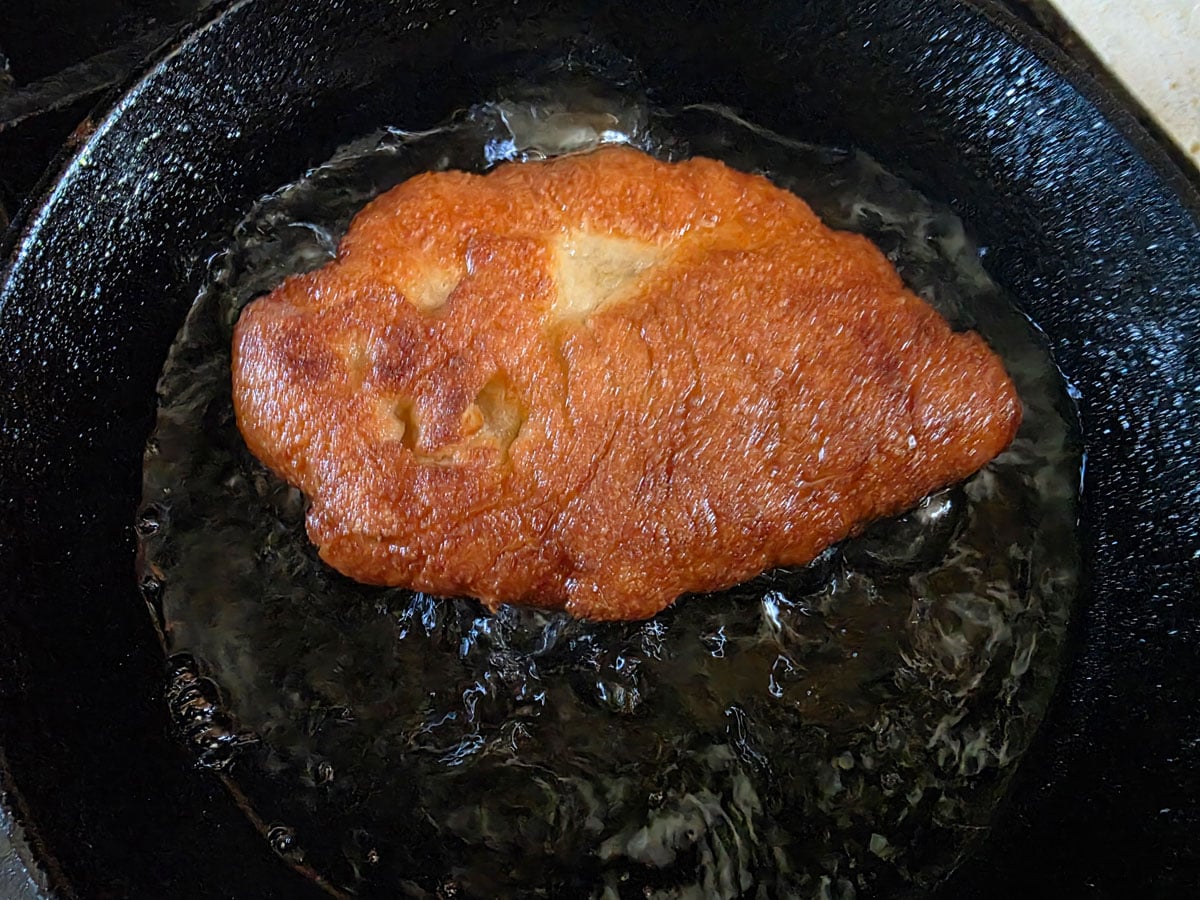Dough flipped over to show a golden brown exterior.