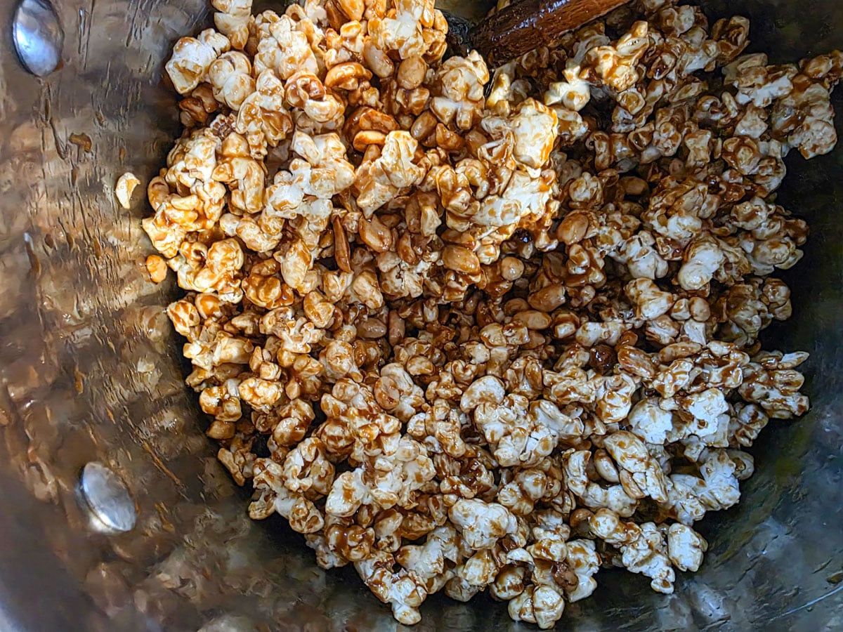 Popcorn and nuts mixed into the caramel sauce.