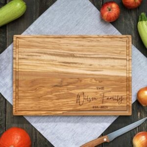 Forest Decor Olive Cutting Board with vegetables.