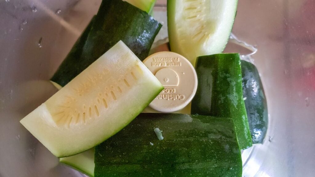 Zucchini in a food processor.